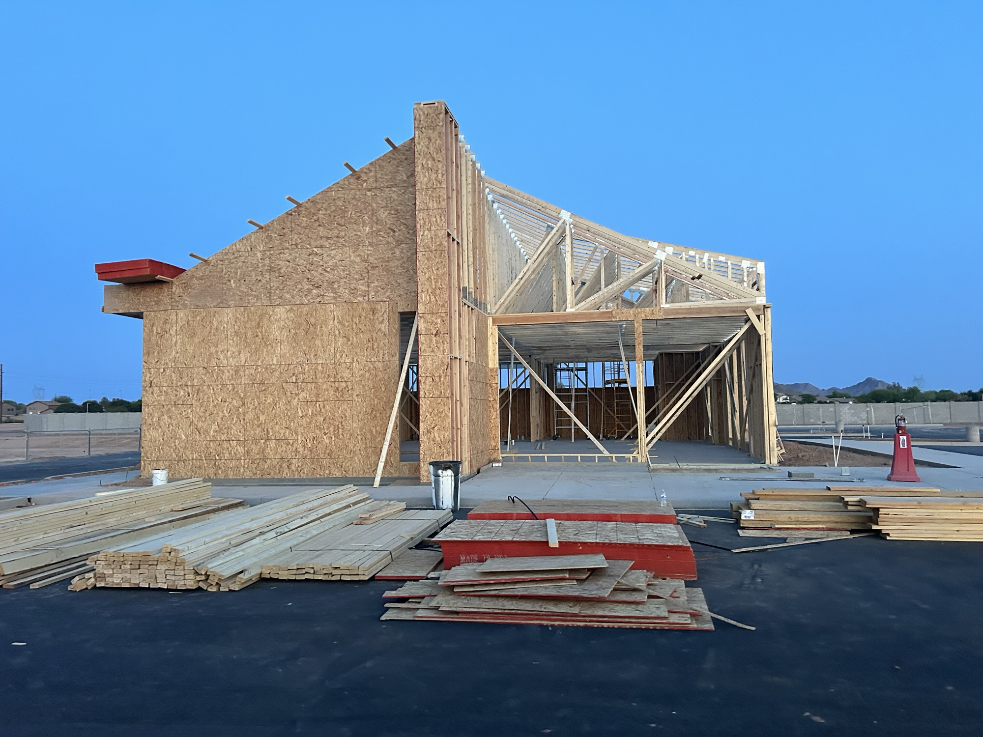 Front of building with drywall and fully paved parking lot